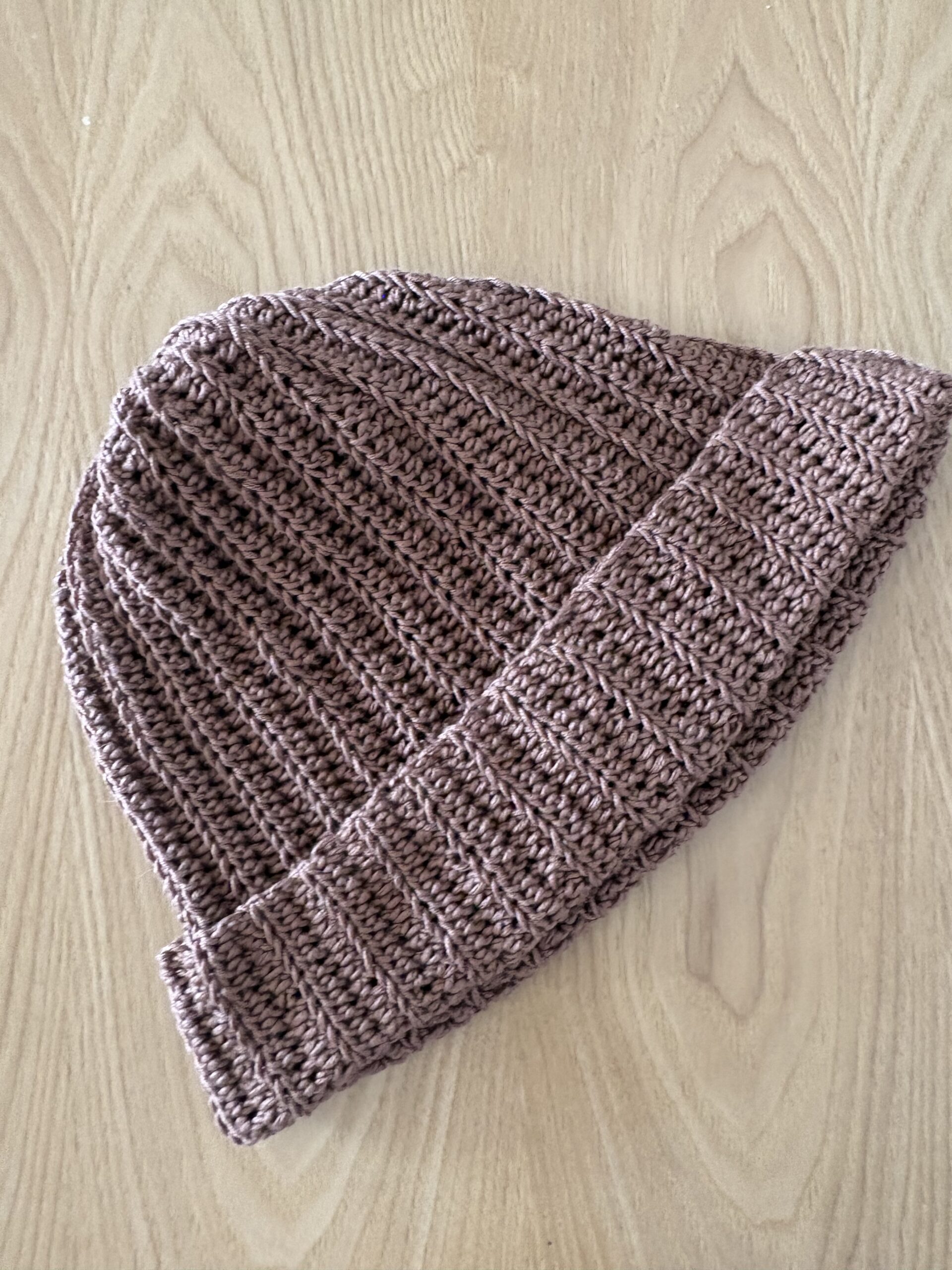 Learn how to crochet an easy ribbed beanie that looks professional and store-bought! This free pattern uses just two basic stitches. Perfect for beginners!